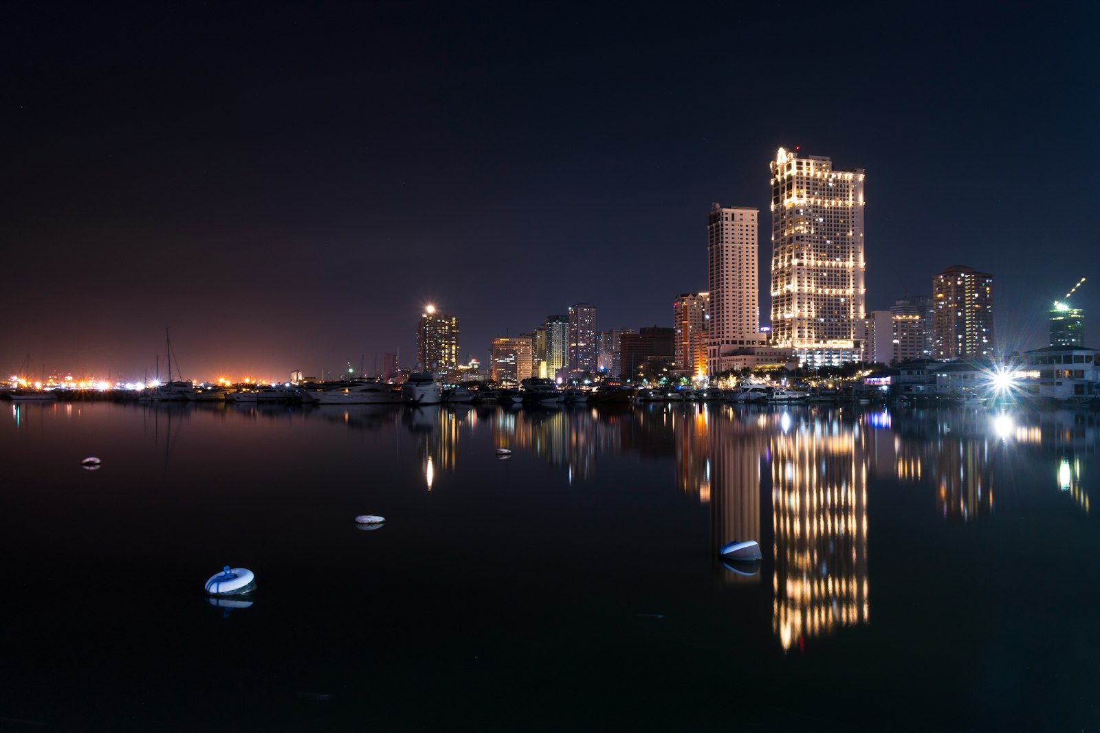 Manila Bay skyline viewed across the waterfront in the Philippines.