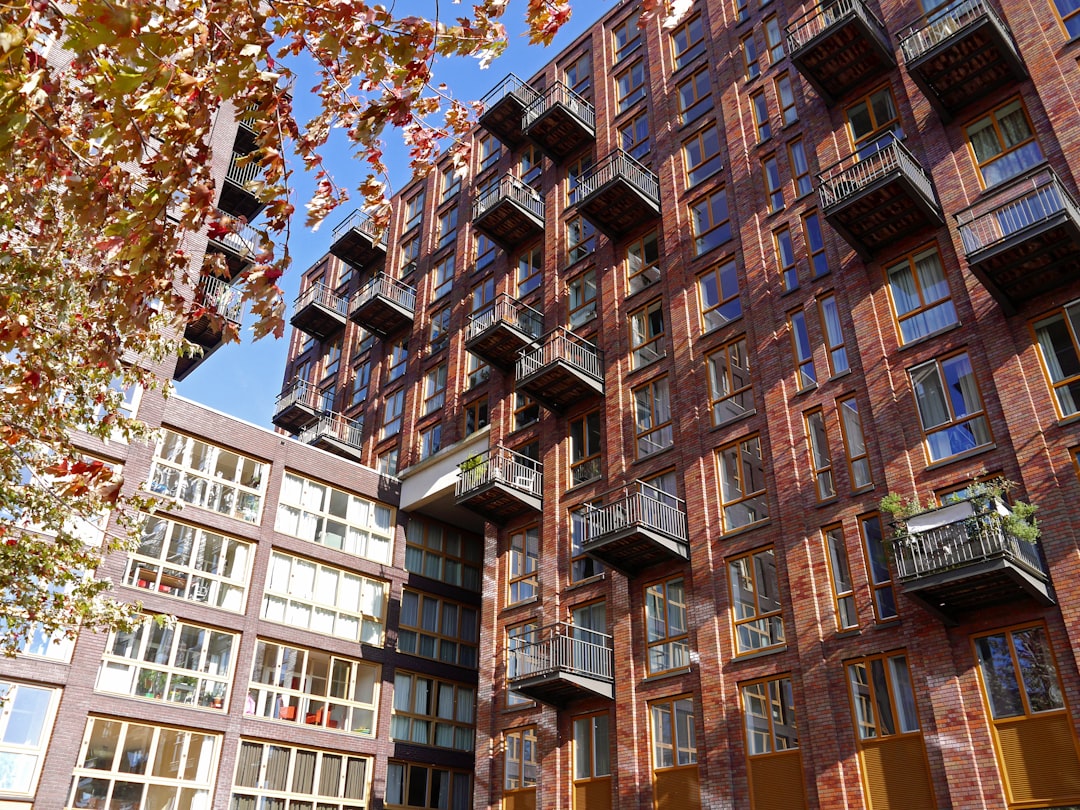 Modern residential apartment buildings with balconies in a city streetscape